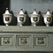Dettaglio di un arredo ligneo con vasi d'epoca della Farmacia del Galluzzo, Firenze.