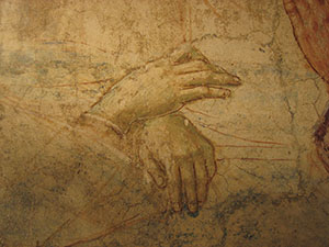 Tabernacle of the Madonna of the Cough, detail of the hands in the scene depicting the death of the Madonna in which the preparatory drawing is visible with a clear light/dark contrast.