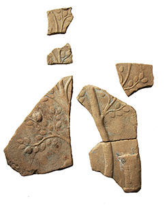 Fragments of pinax with parts of a tree