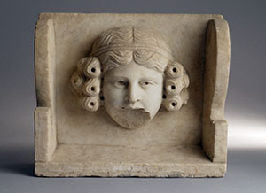 Corbel with female mask