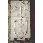 Stone coat of arms of the Hospital of Santa Maria della Croce, Montalcino.