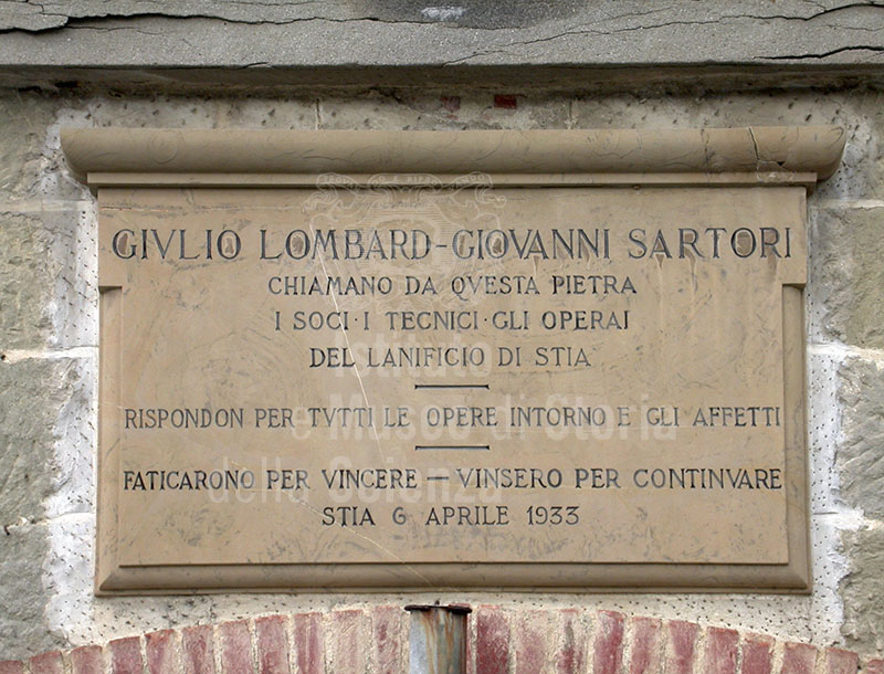 Commemorative plaque on the facade of the Wool Mill in Stia, 1933.