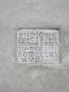 Epigraph walled into the faade of the Hospital of San Luca or of the Misericordia, 1397, Lucca.