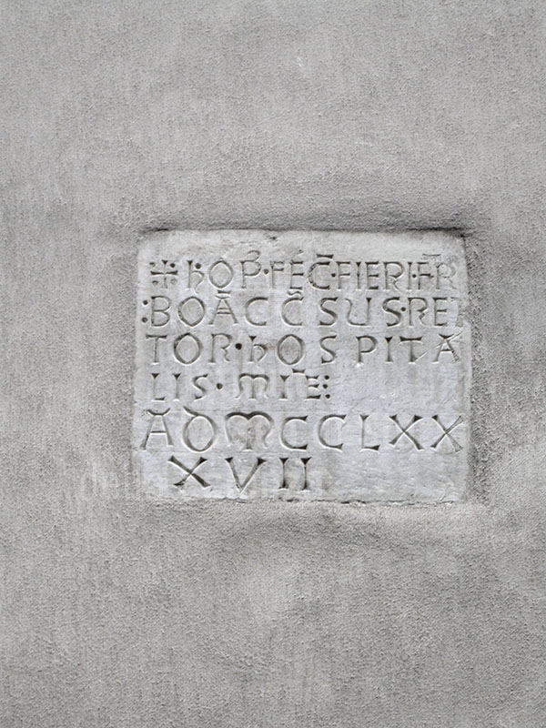 Epigraph walled into the faade of the Hospital of San Luca or of the Misericordia, 1397, Lucca.