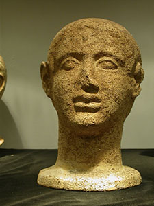 Clay head from the Hellenistic Age coming from the votive offerings of Ghiaccioforte, Museo Archeologico of Scansano.