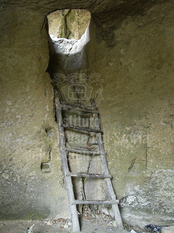 Stone stairway in an inhabited grotto on two levels in the medieval rupestrian village of Vitozza, Sorano.