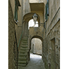 Narrow lane in the medieval town of Giglio Castello.