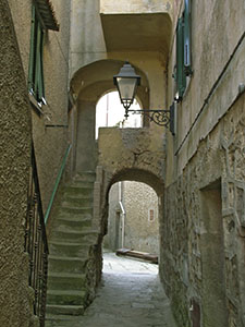 Narrow lane in the medieval town of Giglio Castello.