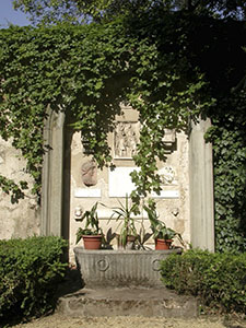 Inscriptions and stone tablets built into the boundary wall of the garden of Palazzo Guicciardini, Florence.