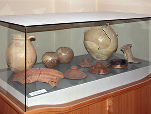 Earthenware pottery (pots, covers, pitcher, neck of Graeco-Italico amphora, border of dolio), Museo Archeologico di Scansano (adjacent to the Museo della Vite e del Vino).