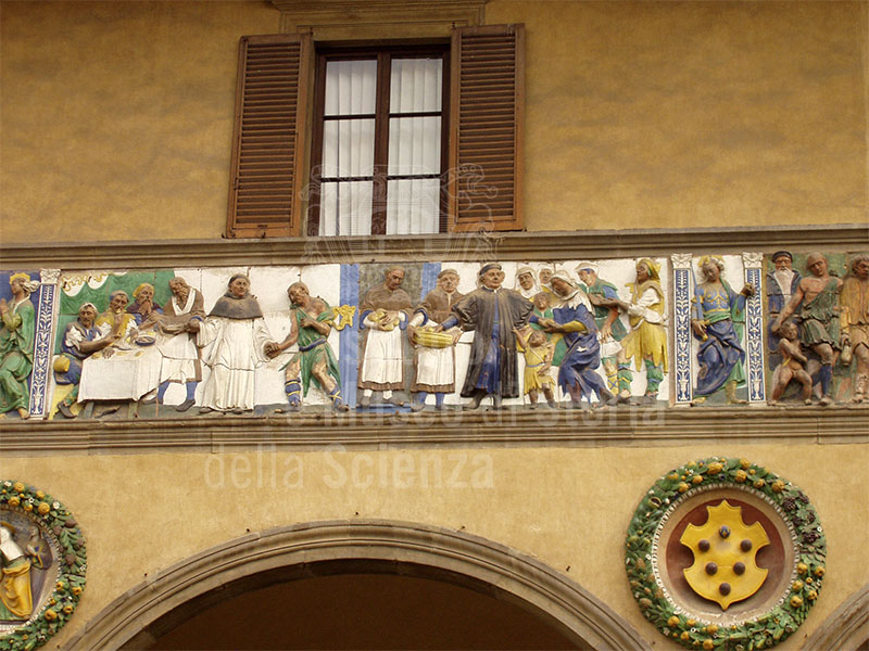 "Feed the hungry", Della Robbian polychrome frieze on the ancient faade of the Hospital del Ceppo, glazed terracotts,Santi Buglioni, 1526-28, Pistoia.