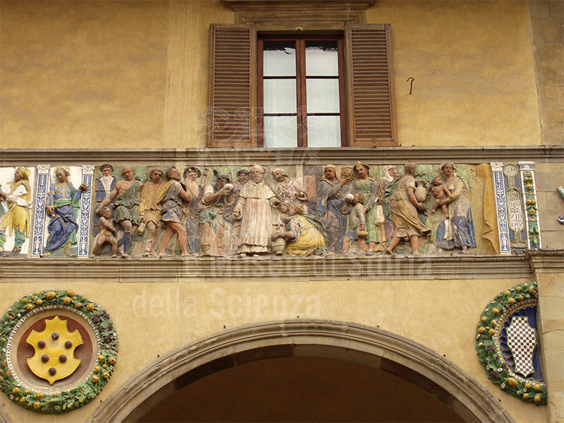 "Give drink to the thirsty", Della Robbian polychrome frieze on the ancient faade of the Hospital del Ceppo, glazed terracotta, Filippo di Lorenzo Paladini, 1585, Pistoia.