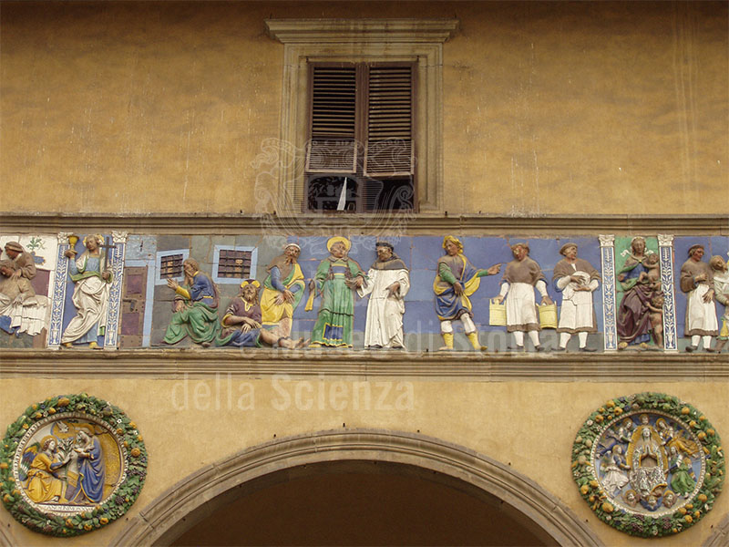 "Visit the imprisoned", Della Robbian polychrome frieze on the ancient faade of the Hospital del Ceppo, glazed terracotta,Santi Buglioni, 1526-28, Pistoia.
