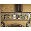 "Vestire gli ignudi e assistere le vedove", fregio policromo robbiano sull'antica facciata dello Spedale del Ceppo, terracotta invetriata, Santi Buglioni, 1526-28, Pistoia.
