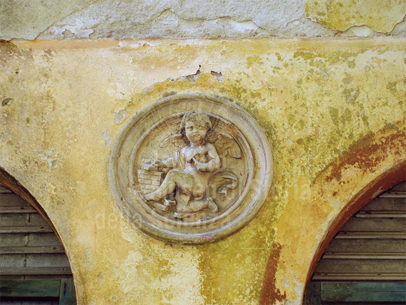 A putto working, decorative detail of the ex Bianchi Paper-mill, Bagni di Lucca.