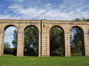 Arches of the Nottolini Aqueduct with buttress in the countryside of Lucca, Lucca.