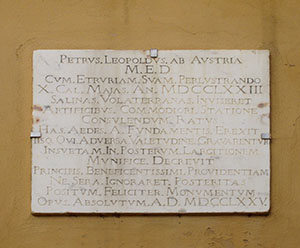 Commemorative stone tablet on the building of the State salt mines at Saline di Volterra.