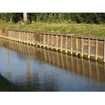 Detail of banking of the Molino a Fuoco canal. Since 2006, banking with wood has been preferred to the old system of compacted earth, to ensure better maintenance and less erosion of the banks. Località Molino a Fuoco, Vada.