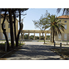 Veduta da viale del Tirreno del portico di collegamento degli edifici principali e del viale di ingresso, Collegio del Calambrone, Calambrone, Pisa.