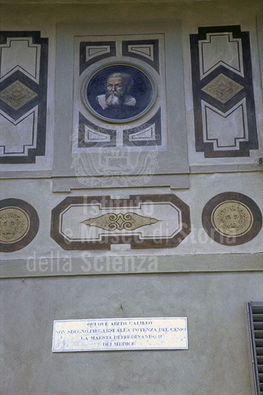 House of Galileo on Costa San Giorgio:  detail of the facade decorated with frescoes with a portrait of the scientist and a commemorative plaque, Florence.