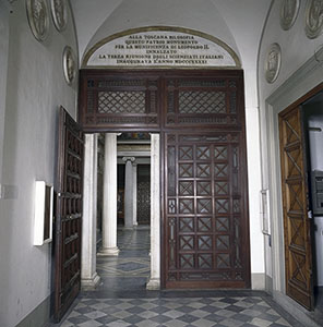 Front door of the Tribuna di Galileo surmounted by a stone tablet commemorating the inauguration of the building on the occasion  of the Third Congress of Italian Scientists (1841), Florence.