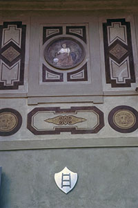 House of Galileo on Costa San Giorgio:  detail of the facade with an allegorical depiction in the middle, and the family coat of arms below, Florence.