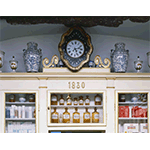 Wall-mounted clock in the Antique "del Cervo" Pharmacy, Arezzo.