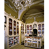 Interior of the Pharmacy of San Jacopo, Leghorn. At center, counter scale surmounted by a bronze statuette of Mercury.