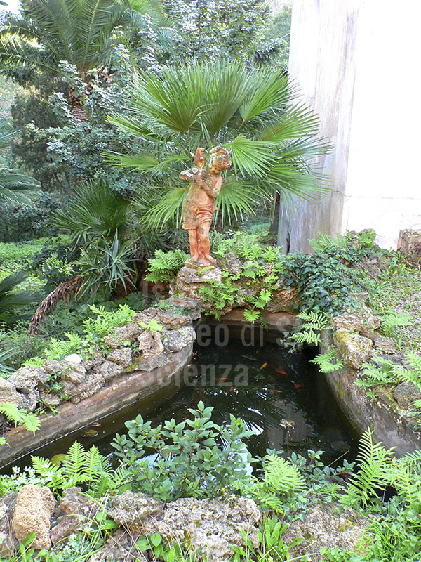 Pool with terracotta putto in the Botanical Garden of Ottonella, Portoferraio.
