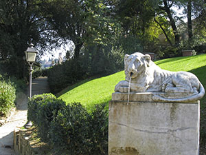Garden of Palazzo Mozzi Bardini, Florence: stone lion on the end stone of an ancient channel.