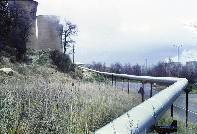 Piping and cooling towers of geothermal energy plants, Larderello.