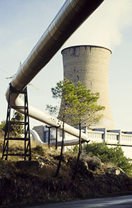 Piping and cooling towers of geothermal energy plants, Larderello.