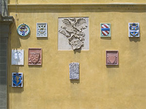 Coats of arms on the inner faade of the Stibbert Museum, Florence.