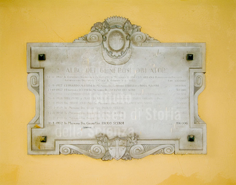 Stone tablet with inscription in the courtyard of the United Hospitals of Santa Chiara, Pisa.