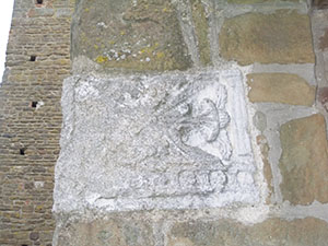 Plaster cast of an Etruscan funerary urn on the facade of the Parish Church of San Leonardo in Artimino.