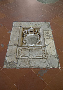 Tomb in the floor of the Cathedral of Pienza.