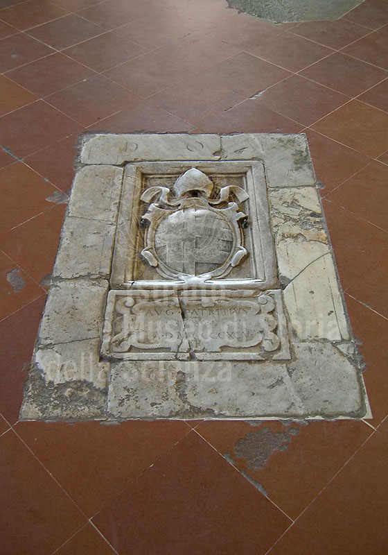 Tomb in the floor of the Cathedral of Pienza.