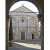 The facade of the Cathedral of Pienza seen from the portico of Town Hall.