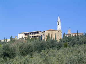 Palazzo Piccolomini and the Cathedral of Pienza seen from the surrounding countryside.