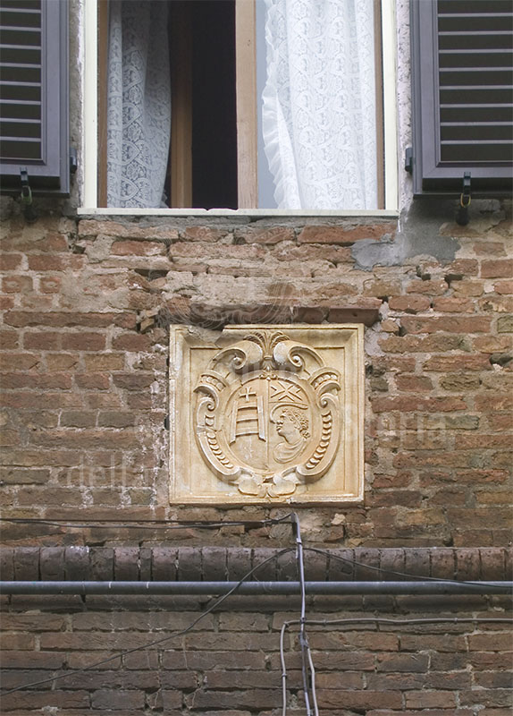 Coat of arms of S. Maria della Scala on the wall of the Cuna Grange, Monteroni d'Arbia.