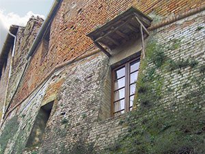 Window on the inner circle of walls of the Cuna Grange, Monteroni d'Arbia.